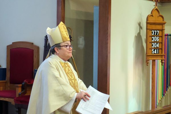 Bishop Diane in front of parishioners