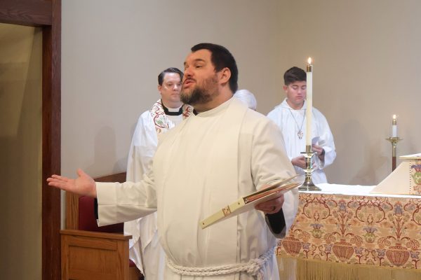 Jon Galles greeting the congregation