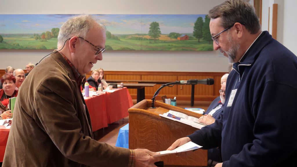 Peter DeVeau accepting honorary Canon