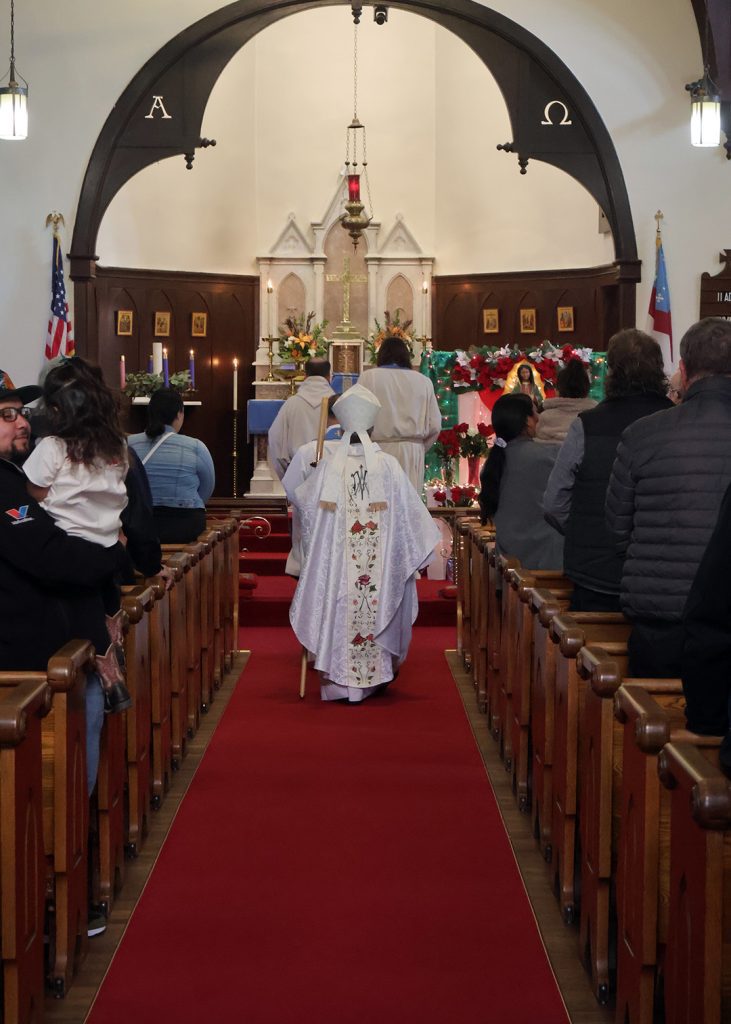 Bishop walking down aisle