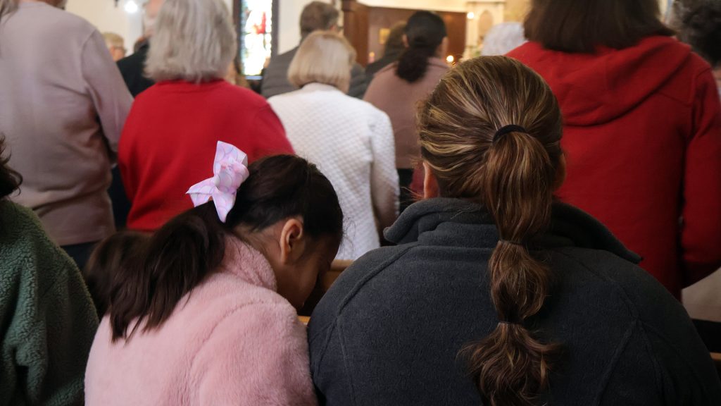mother and daughter sitting together