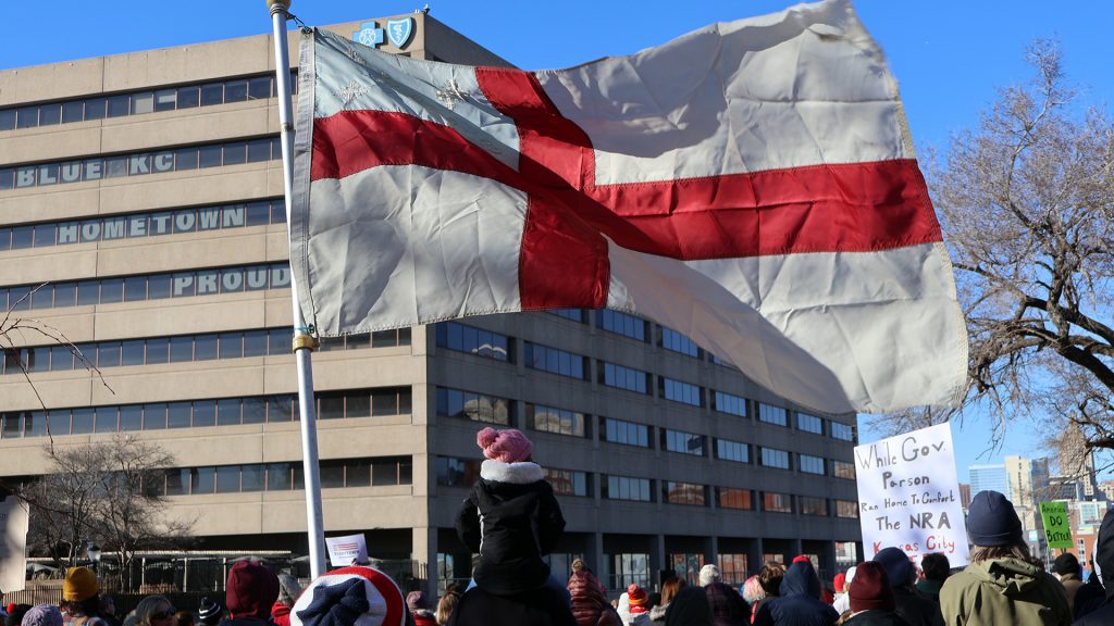 Episcopal Flag Waving Over Crowd
