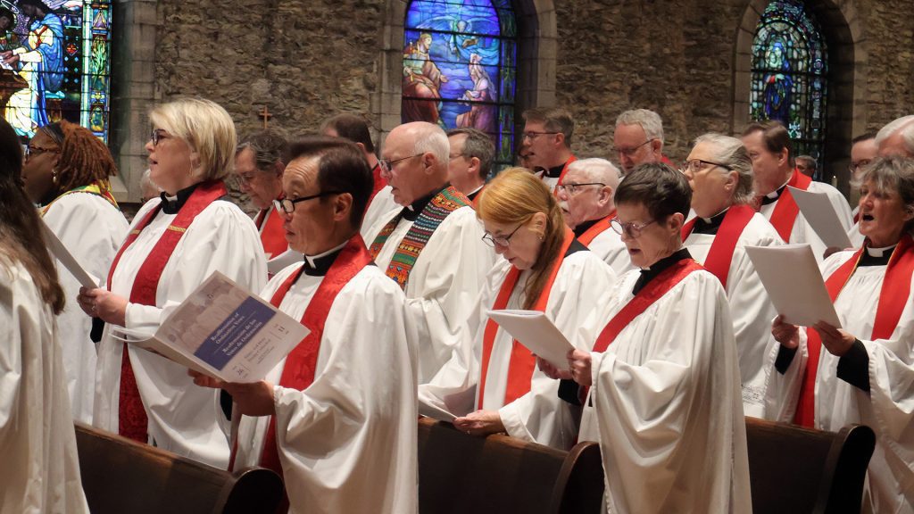 Clergy praying at renewal service